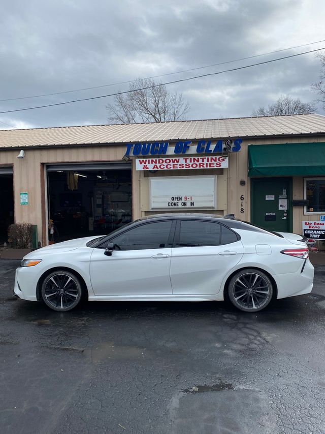 White sedan with professionally tinted windows at Touch of Class